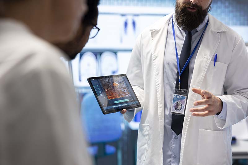 doctor reviewing solutions with patient using medical ai on a tablet
