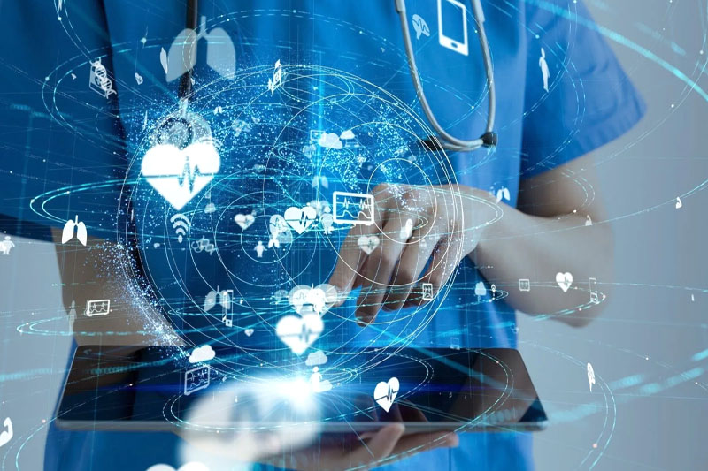 person in scrubs using a tablet